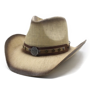Vintage straw cowboy hat with wide brim, brown spray paint edge and star metal rivets