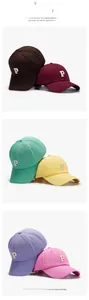 Detail view of colorful cotton baseball caps with embroidered P letter in six vibrant shades