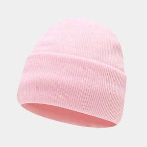 Close-up of pink knit beanie with ribbed texture and folded cuff for winter warmth
