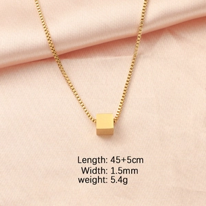Close-up of golden cube pendant necklace with dimensions 45+5cm and 1.5mm width details