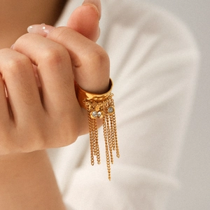 Gold stainless steel open ring with dangling chain tassels and shimmering zircon accents