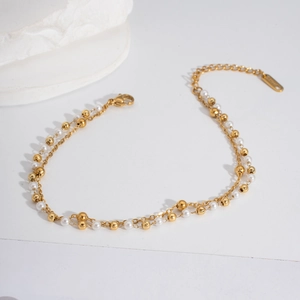 Elegant double-layer stainless steel anklet with gold chains and white pearl accents