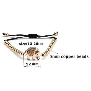 Detail of copper bead bracelet with zircon elephant charm and adjustable black rope