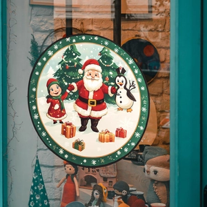 Christmas window cling featuring Santa Claus, penguin and tree for festive home glass decoration