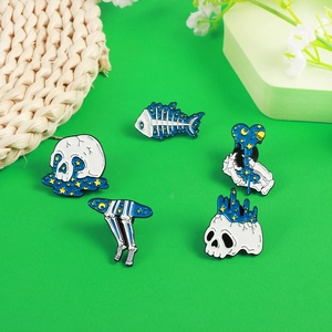 5-piece starry sky skull enamel pin set with blue cosmic and moon theme designs