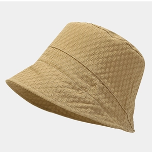 Women's foldable bucket hat with yellow 3D bubble texture for stylish sun protection