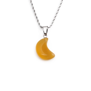 Macro detail of twisted silver chain with yellow crescent moon stone pendant necklace