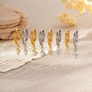G23 Titanium hoop earrings with zircon star and flower charms in gold and silver