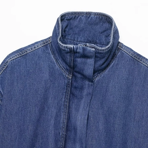 Classic dark blue denim jacket featuring a high stand collar and hidden placket detail