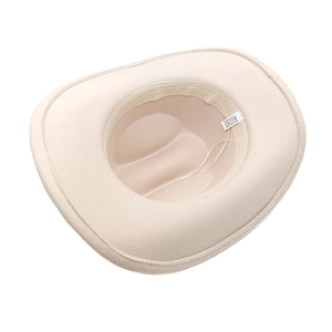 Detail of beige felt cowboy hat interior with adjustable strap and material tag