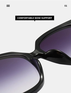 Detail of comfortable integrated nose pads on large square black sunglasses with purple lenses