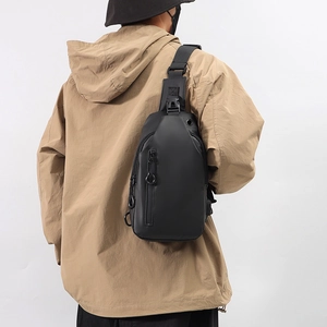 Waterproof black crossbody chest bag for men shown on model with minimalist design