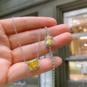 Elegant jewelry set featuring square yellow zircon pendant necklace and matching silver bracelet