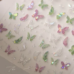 Macro detail of 5D laser butterfly nail stickers with aurora rainbow chrome finish