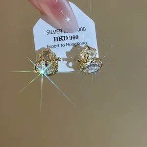 Gold-plated silver gourd stud earrings with brilliant zircon stones and bow detail