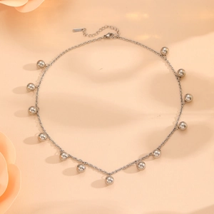 Silver stainless steel necklace featuring spherical bead pendants and adjustable clasp