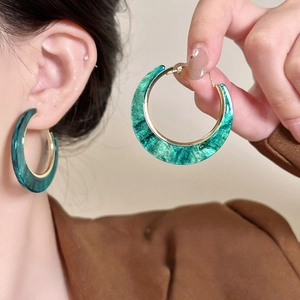 Bohemian large green acrylic hoop earrings with elegant gold inner metal trimming
