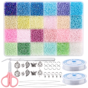Detail view of 24-compartment DIY bead kit with charms, scissors, and elastic strings