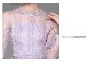 Close-up of purple lace dress with floral embroidery and delicate hollow-out details