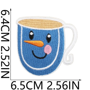 Detail of blue snowman cup embroidery patch showing dimensions 6.4x6.5cm on white background