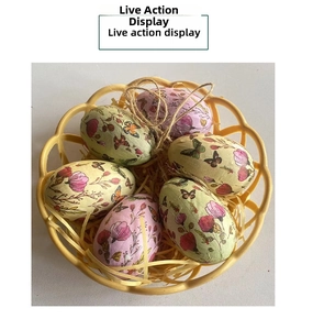 Easter decorative eggs with floral patterns in a bamboo basket with straw filling