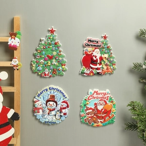 Set of 4 festive Christmas resin fridge magnets with Merry Christmas greetings on a wall