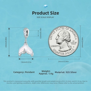 Size comparison of a 925 silver mermaid tail pendant next to a 25-cent coin