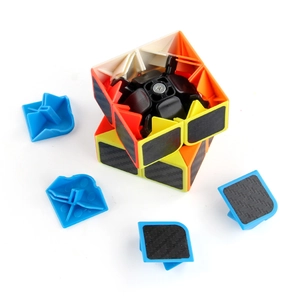 Disassembled 3x3 carbon fiber magic cube showing smooth internal core and spring mechanism