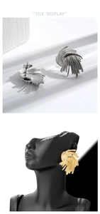 Detailed macro view of gold and silver fan-shaped wheat ear studs with ribbed metal texture