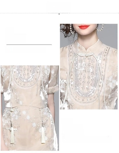 Detail of mandarin collar with sequins and waist tassel on champagne evening dress