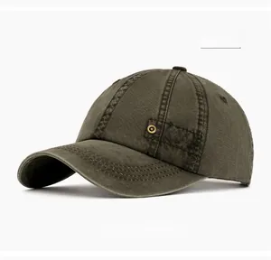 Detail view of washed army green cotton fabric and side brass rivet eyelet on a baseball cap