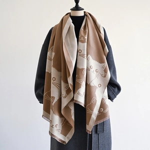 Detailed close-up showing the double-sided cat pattern and tassels on the warm thick shawl