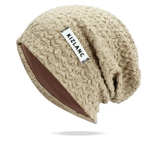Detail of the textured crepe fabric and double-layer lining on this breathable slouchy beanie