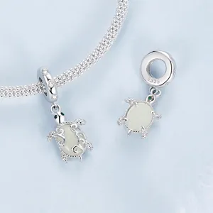 S925 sterling silver sea turtle charm with luminous stone and intricate hollow patterns