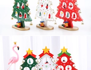 Detail of mini wooden Christmas tree with miniature figures and a small train base