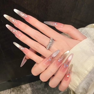 Pink cat-eye press-on nails with silver glitter gradient and long almond shape