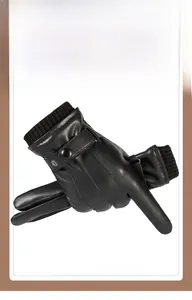 Detail of black PU leather gloves with knitted windproof cuffs and adjustable metal buckle strap