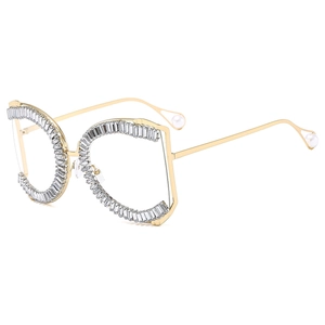 Fashionable gold metal sunglasses with sparkling rhinestone frame and pearl detail