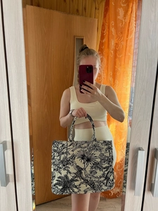 Mirror selfie showing the large tiger print toile de jouy tote bag for women