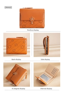 Detail view of orange floral embossed wallet with card slots and metal flower charm