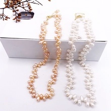 Detail of freshwater baroque pearl necklace set with 14k gold plated lobster clasp closure