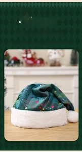 Close-up of green plush Christmas hat with colorful stars and white faux fur trim