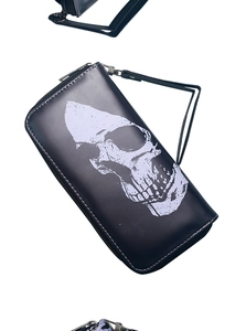 Detailed close-up of a long leather wallet with a white skull print and zipper strap