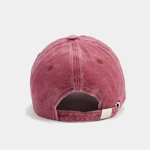 Close-up of the vintage washed burgundy cotton baseball cap with adjustable metal buckle