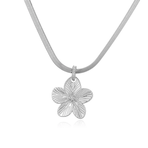 Detailed view of silver herringbone chain with textured flower pendant and crystal bail