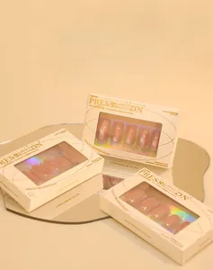 Close-up of nude pink cat-eye press-on nails in premium branded window packaging