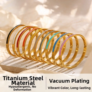Detailed arrangement of colorful titanium steel bangles with gold vacuum plating finish