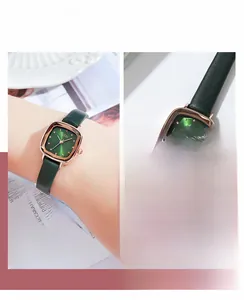 Detail view of GEDI retro square watch with dark green leather strap and gold case