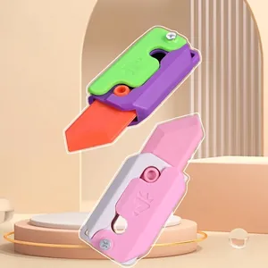 Luminous 3D gravity carrot knife fidget toy in green and pink color combinations