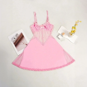 Flat lay of pink lace chemise with mesh skirt, floral embroidery and bow detail